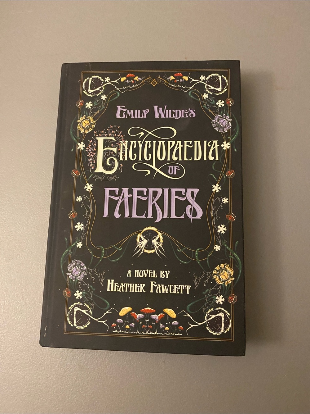 Emily Wilde's Encyclopaedia of Faeries Hardcover Book - Black & Purple